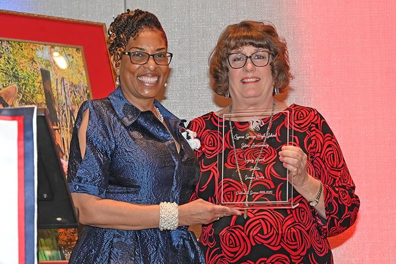 Dr. Cheryl Henry presented Jeanne Davis, retired Cypress Springs staff member, one of two “Legacy Awards”